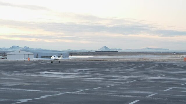 Light Aircraft at the Icy Airport of Reykjavik in the Morning Light.