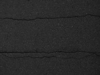 Obraz premium crack black asphalt road texture
