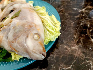 Steamed Fish with Chili Lime Sauce,thai Traditional Thai food. : thai style steamed fish on table close up 