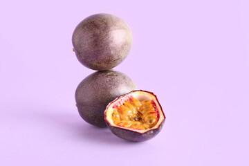 Delicious passion fruits on purple background