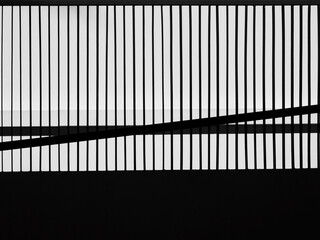 silhouette of fence with white wall background