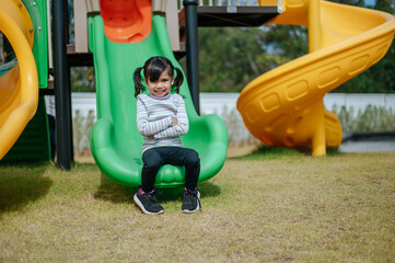 Girls play slides in the playground
