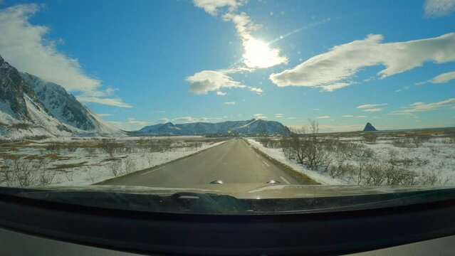 Windshield view driving on scenic route in Andoya to the Village Bleik on a Sunny cloudy day, Norway, Scandinavia