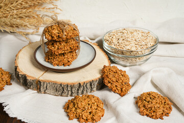 The oatmeal cookies or healthy cereal oat crackers. Crispy anzac biscuit cookie with oat flakes on rustic table