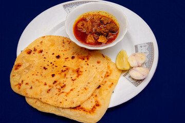 Bengali Food Beef with Paratha on Blue Background