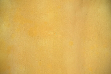 golden yellow old plaster wall and floor tile texture