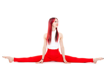 A beautiful, athletic, slim, smiling and cheerful woman in a white top and red sweatpants performs stretching and Pilates elements. Lifestyle concept with sports and gym, healthy lifestyle. Isolated
