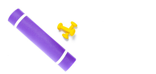 Yoga mat and dumbbells Isolated on white background