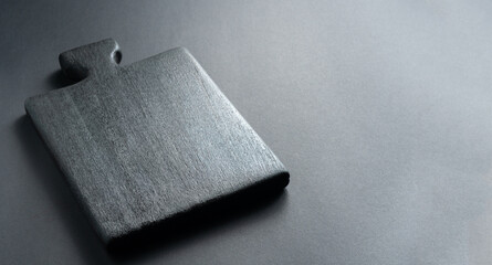 Black kitchen table on a gray background. Empty table. Copy space.