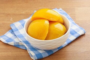 Sweet canned peaches with syrope