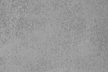 Old gray roughcast exterior wall texture. Grey pebbledash coarse plaster surface abstract background