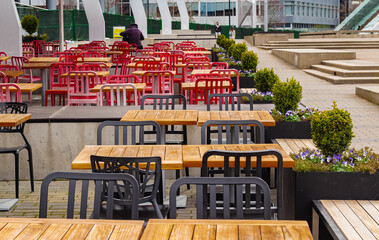 View of empty outdoor cafe in Vancouver BC. Open air cafe with chairs and tables.