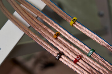 Closeup of set of acoustic cables with number labels