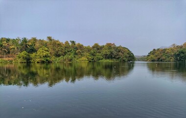 Bank’s of river Periyar at bhoothathankettu, kerala. Reflection of nature on the surface of river.