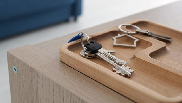 Take House Keys From. Keys In Hand. The Keys Are On The Table In The Hallway. Take The Keys From The Table Before Leaving. Home Sweet Home Concept