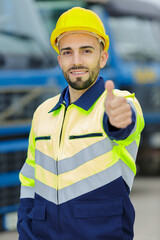 thumb up from the worker wearing protective clothing and helmet