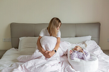 Tired Mother Suffering from experiencing postnatal depression. Health care mom motherhood...