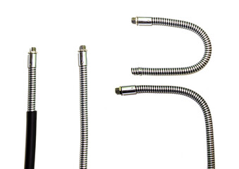 Flexible metal hose for protecting electrical wiring or water pipes. A set of pipes in different positions.