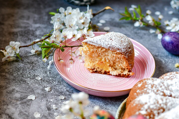 Homemade  Italian style  Easter  bread cake, spring blossom  and  hand colored eggs. Homemade pastry.  Easter holiday baking and decorarion