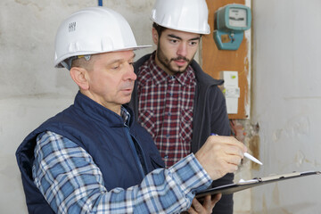 two men with a clipboard