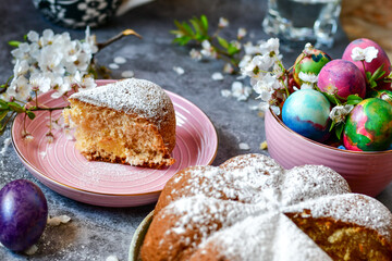 Homemade  Italian style  Easter  bread cake, spring blossom  and  hand colored eggs. Homemade pastry.  Easter holiday baking and decorarion