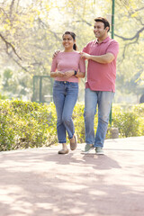 Fototapeta premium Beautiful couple admiring view at park