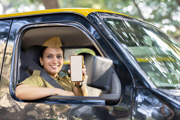 Woman taxi driver showing mobile phone screen