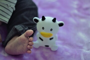 Naklejka premium baby foot and toy