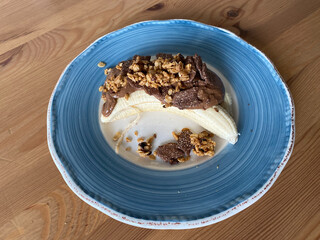 Protein Raw Breakfast with Banana, Granola, Peanut Butter and Cereal Grains.