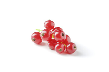 Berries of ripe tasty red currant isolated on white background. red currant with a leaf. a slide of red currants. Red currant berries with leaf isolated on white background.