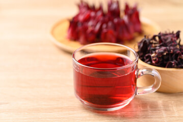 Roselle tea on wooden background, Healthy herbal drink