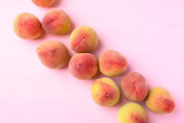Peach fruit on pink background, Flat lay, Top view