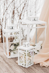 Decor for a wedding arch with flowers and fabric in spring or winter. The place of the bride and groom for the ceremony in nature