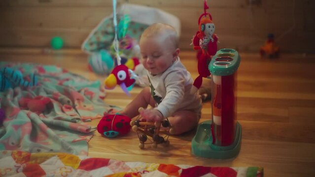 Toddler Pulling Soft Toys In Bedroom At Home - Fairbanks, Alaska