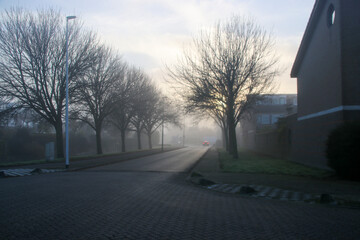 Misty streets and canals in an autumn Nieuwerkerk aan den IJssel