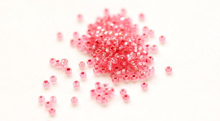 Glass beads. Pink color. Isolated on white background.	