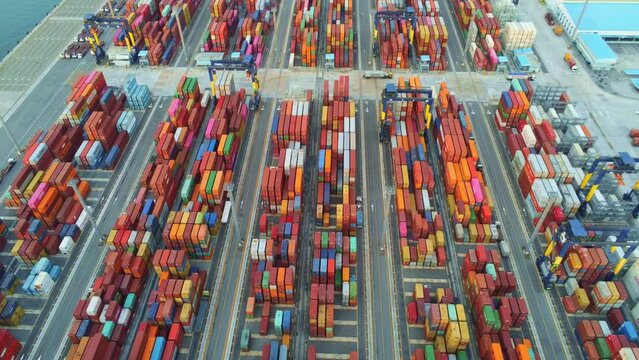 cargo ship and truck at seaport waiting for container dock crane shipment harbor loading container import and export commercial trade business logistic and transportation international.