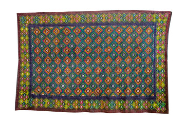 Handmade carpet with rhombus ornament isolated on white background.