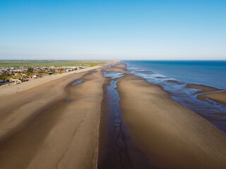 Aerial drone. Camber Sands in East Sussex. Popular seaside destination with large sandy beach and...