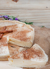 baked milk tart. a baked version of traditional South African milk tart or melktert, with cinnamon and rustic table