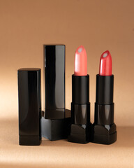 Obraz premium Palette of red lipsticks on nude background