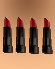 Red lipstick on beige background