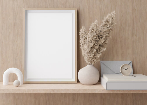 Empty vertical picture frame standing on shelve in modern room. Mock up interior in contemporary style. Free, copy space for picture. Pampas grass in vase. 3D rendering.