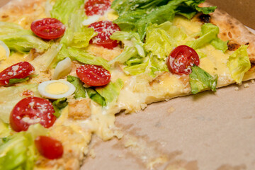 Delicious hot pizza in cardboard box. Selective focus.