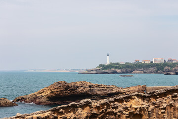 Unique in their color, texture and shape, Rocher de la Vierge rocks protruding from sea. Biarritz,...