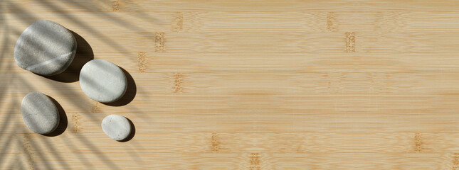 Zen stones background. Sea stones on a bamboo surface. Relaxation, harmony, tranquility, meditation...