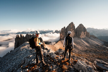 Dolomites, Three Peaks of Lavaredo. Italian Dolomites with famous Three Peaks of Lavaredo, Tre Cime , South Tyrol, Italy,..People climbing on a via ferrata route paternkofel. - obrazy, fototapety, plakaty