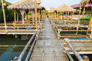 Walking suspense bridge made of dry bamboo in Thailand.