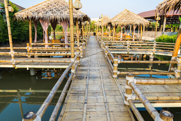 Walking suspense bridge made of dry bamboo in Thailand.