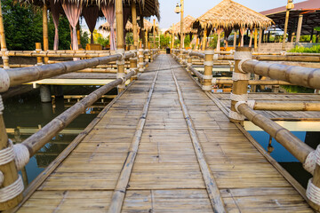 Walking suspense bridge made of dry bamboo in Thailand.